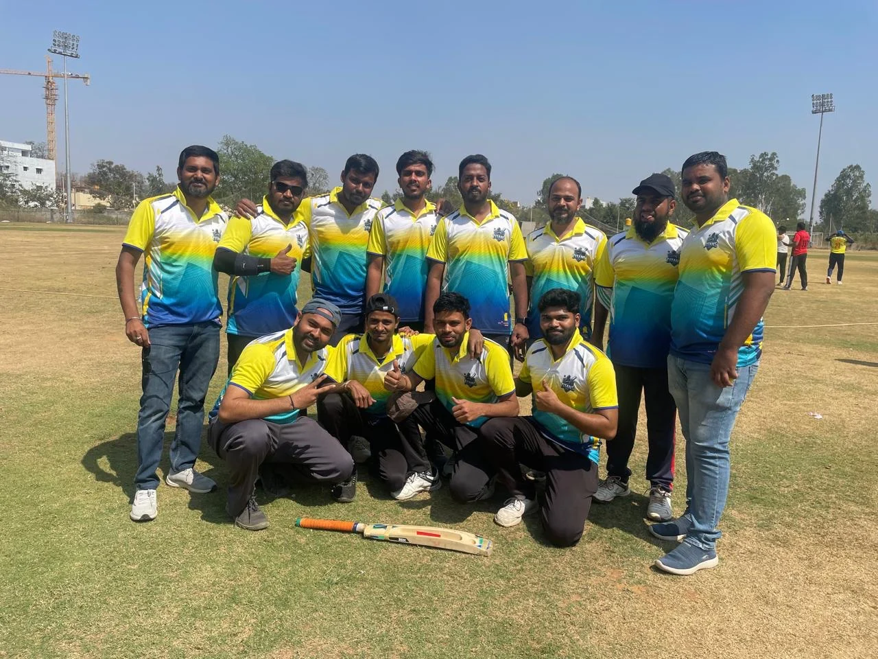 The Ripplr cricket squad in kit on the pitch