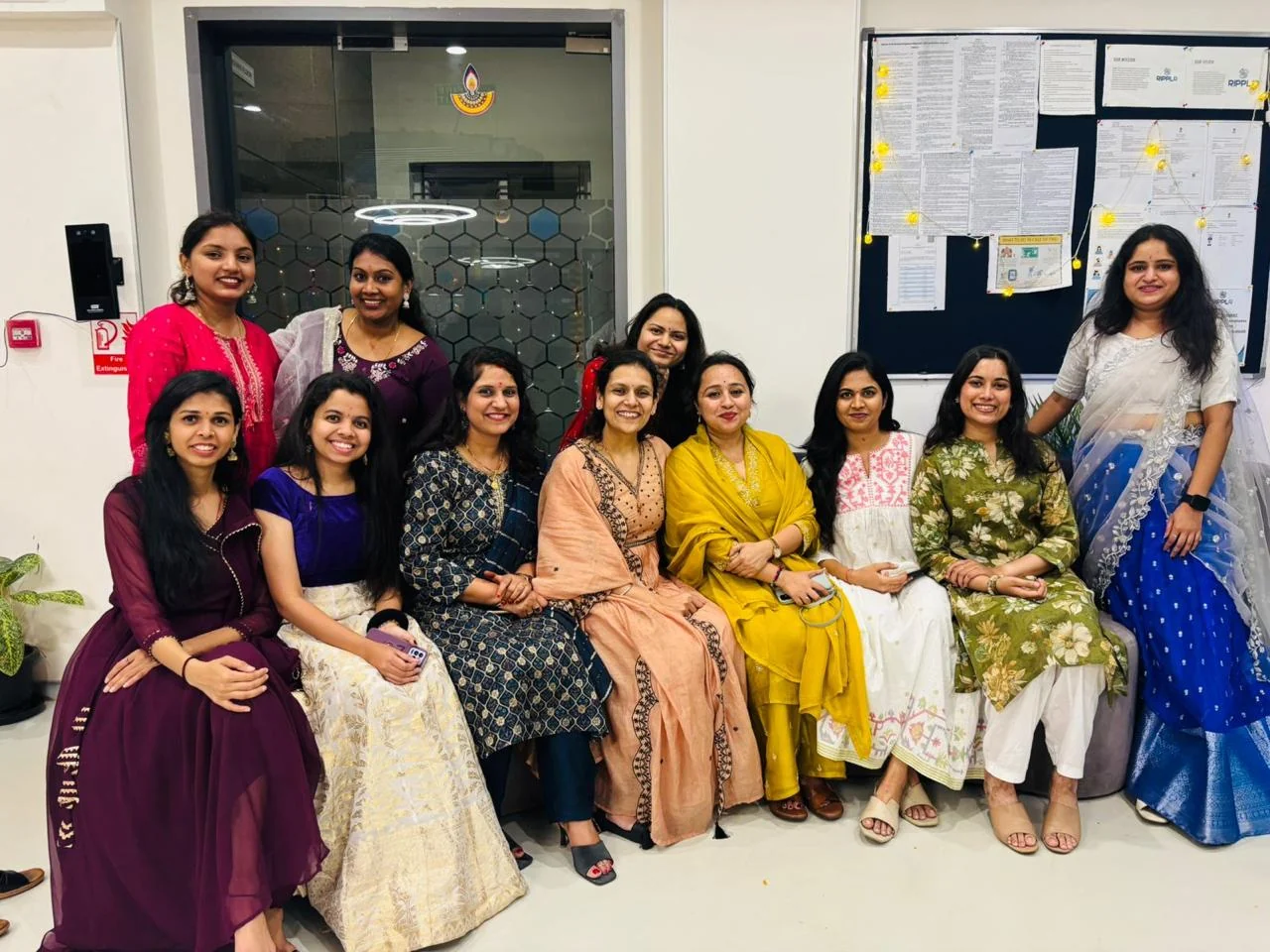 Ripplrites in ethnic wear gathered in the office