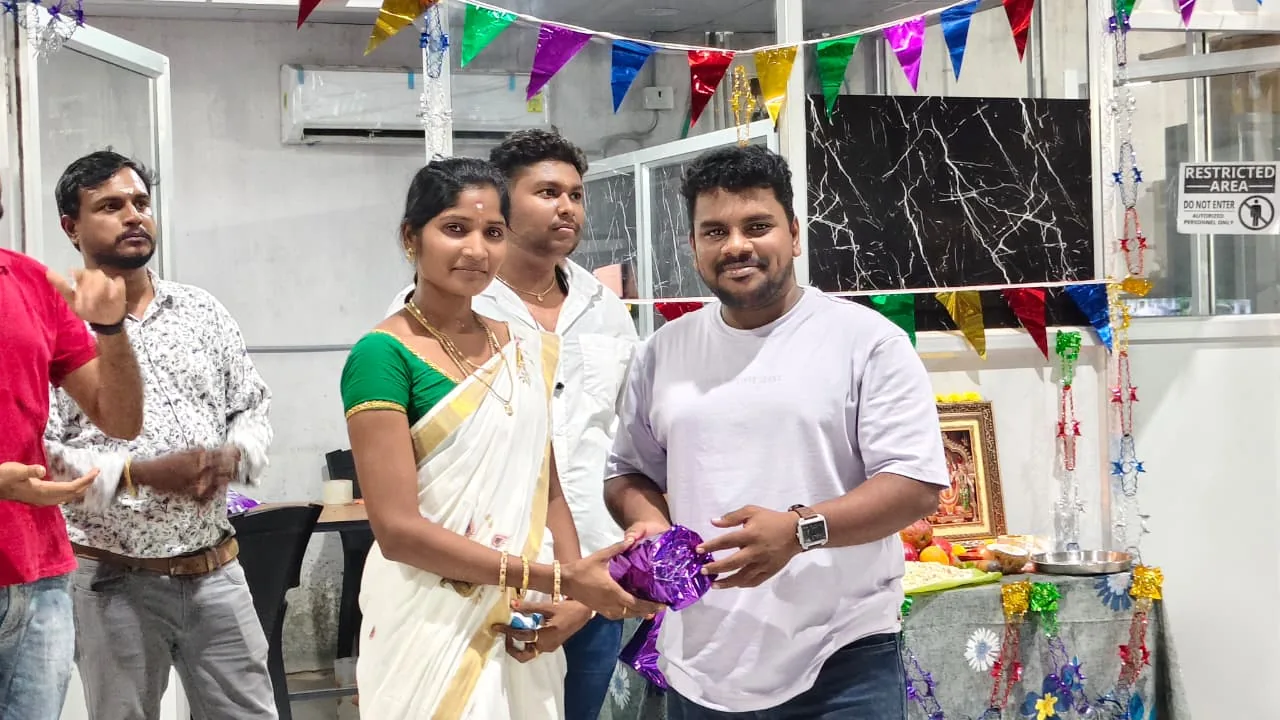 Ripplrites exchanging a garland at an office festival celebration